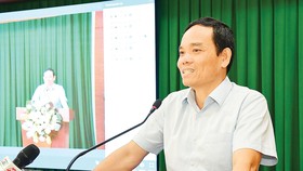 Phó Bí thư Thường trực Thành ủy TPHCM  Trần Lưu Quang phát biểu tại hội nghị. Ảnh: VIỆT DŨNG