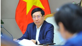 Phó Thủ tướng Thường trực Chính phủ Phạm Bình Minh  chủ trì cuộc họp. Ảnh: TTXVN