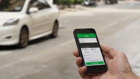 Uber nhượng lại hoạt động kinh doanh cho Grab