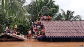 Cảnh ngập lụt sau khi đập thủy điện ở tỉnh Attapeu, Lào bị vỡ ngày 24-7. (Nguồn: THX/TTXVN)