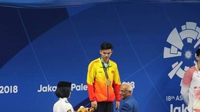 Kình ngư Nguyễn Huy Hoàng đoạt Huy chương bạc nội dung bơi 1.500m tự do nam trong ngày 24-8. Ảnh: DŨNG PHƯƠNG