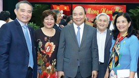 Thủ tướng Nguyễn Xuân Phúc và các đại biểu tại buổi gặp mặt. Ảnh: TTXVN