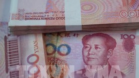 Trung Quốc nâng giá NTD lên mức cao nhất trong 30 tháng