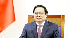 Thủ tướng Phạm Minh Chính trong buổi điện đàm. Ảnh: TTXVN