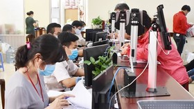 Giải quyết hồ sơ thủ tục hành chính cho người dân, doanh nghiệp tại Sở Tư pháp TP Hồ Chí Minh. (Nguồn: hcmcpv.org.vn)