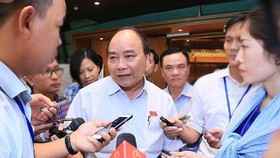 Thủ tướng Nguyễn Xuân Phúc trao đổi với báo chí sáng 7-6-2018. 