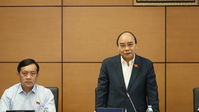 Chủ tịch nước Nguyễn Xuân Phúc phát biểu thảo luận tại tổ ĐBQH TPHCM về tình hình kinh tế - xã hội. Ảnh: QUANG PHÚC
