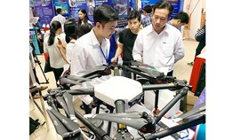 Self-propelled aircrafts to carry out agricultural tasks are on display in a technology exhibition in HCMC. (Photo: SGGP)