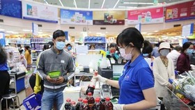 Many supermarkets in HCMC are in need of essential goods to serve the high demand of residents in the city during the social distance time. (Photo: Co.opmart Fanpage)
