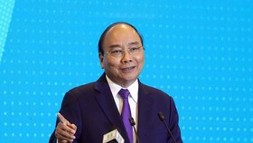 Prime Minister Nguyen Xuan Phuc addresses the “Hanoi 2020 – Investment & Development Cooperation” conference on June 27 (Photo: VNA)