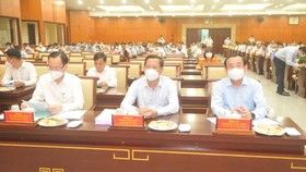 Secretary of the municipal Party Committee Nguyen Van Nen (R), Chairman of the HCMC People’s Committee Phan Van Mai (C) and Chairman of the Internal Affairs Committee of the city's Party Committee Le Thanh Liem (L) at the conference ​