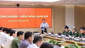 Prime Minister Pham Minh Chinh speaks at the working session with leaders of Viettel. (Photo: VNA)