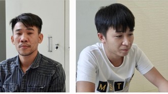 Lê Quang Hùng (trái) và Đỗ Đình Thi tại cơ quan điều tra. Ảnh: CQĐT