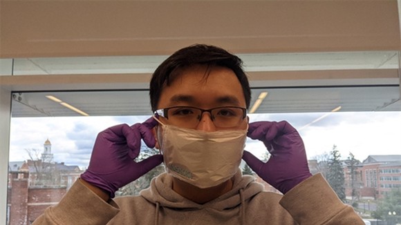 A member of the research team wears the prototype of disposable face masks invented from autolytic piezoelectric polymer sheet. — Photo vietnamnet.vn