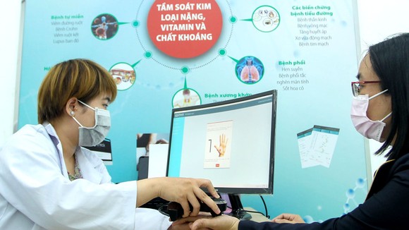 Tiếp nhận thông tin và chẩn đoán bệnh tại Bệnh viện Miền Đông, quận 9, TPHCM Ảnh: HOÀNG HÙNG