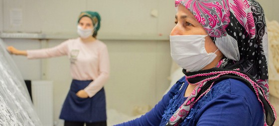 Women textile workers perform quality control tests at a factoy in Izmir, Turkey.