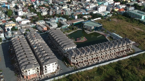 Tháo gỡ ách tắc hàng ngàn dự án bất động sản ảnh 1