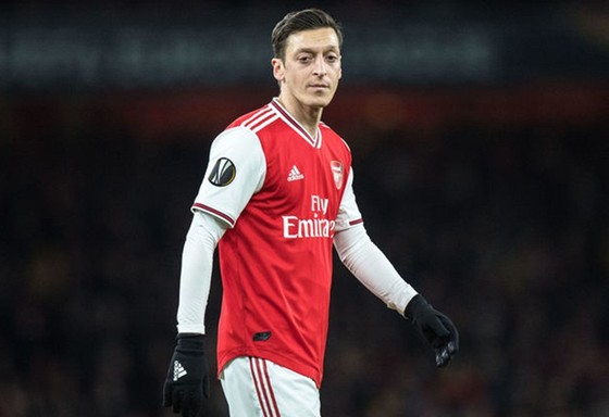 Mesut Oezil chỉ giảm lương khi biết chính xác về tổn thất của Arsenal. Ảnh: Getty Images   