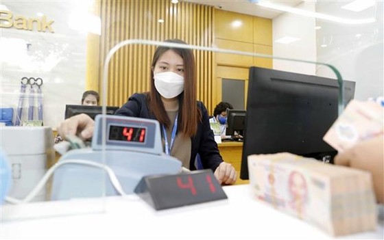 Thị trường tiền tệ trong nước sau quyết định tăng lãi suất của Fed hình ảnh 2 Thi truong tien te trong nuoc sau quyet dinh tang lai suat cua Fed hinh anh 2