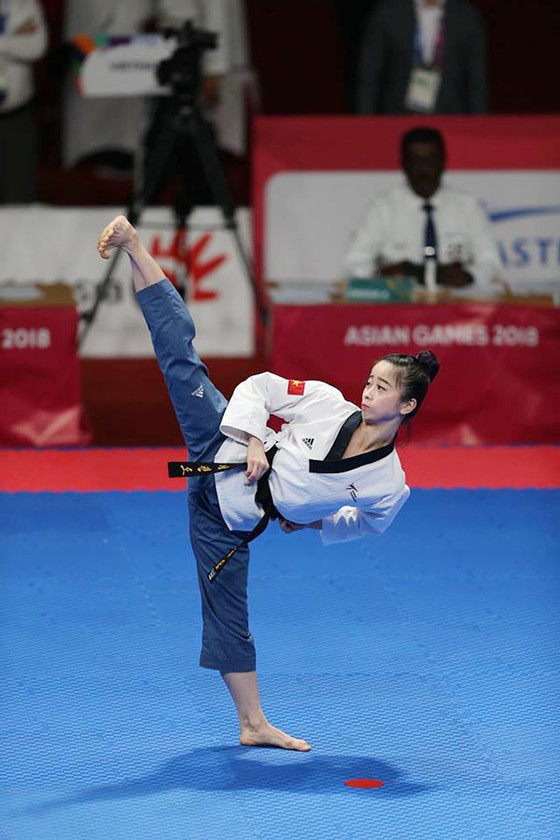 Taekwondo: Đồng đội nam vào bán kết, Châu Tuyết Vân thua VĐV chủ nhà ảnh 3