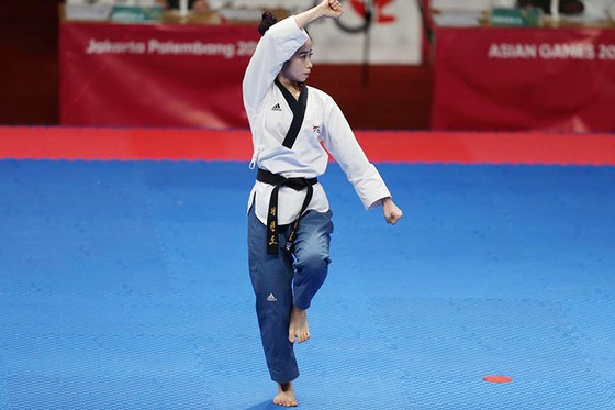 Taekwondo: Đồng đội nam vào bán kết, Châu Tuyết Vân thua VĐV chủ nhà ảnh 4