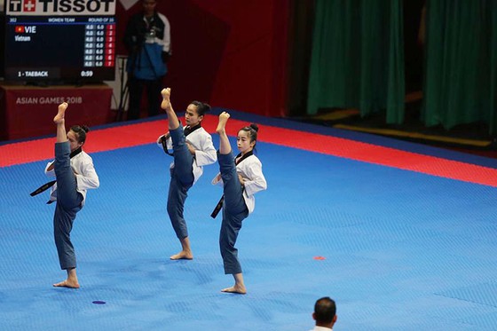 Taekwondo: Đồng đội nam vào bán kết, Châu Tuyết Vân thua VĐV chủ nhà ảnh 5