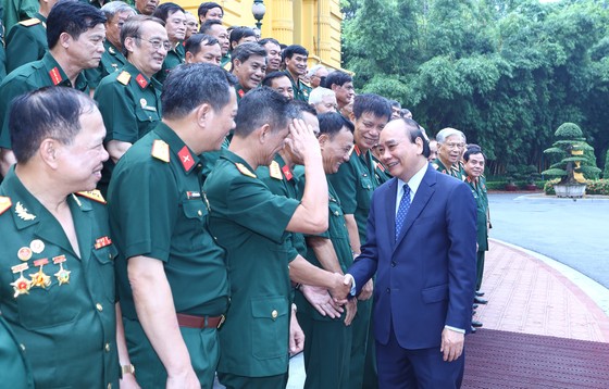 Chủ tịch nước Nguyễn Xuân Phúc tiếp đại biểu cựu chiến binh Mặt trận Vị Xuyên - Hà Tuyên ảnh 1