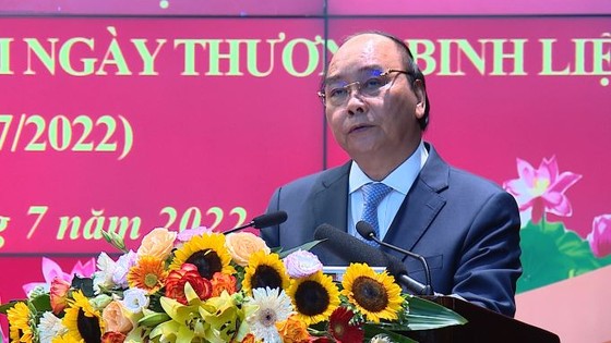 Chủ tịch nước Nguyễn Xuân Phúc: Lực lượng công an đã hoàn thành tốt phong trào 'Đền ơn đáp nghĩa' ảnh 4