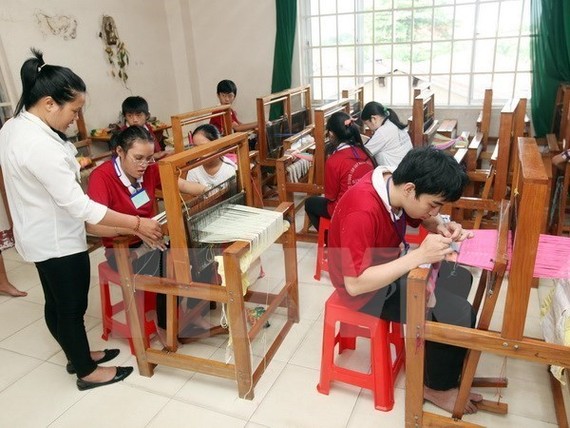 A vocational training class for disabled people (Photo: VNA)