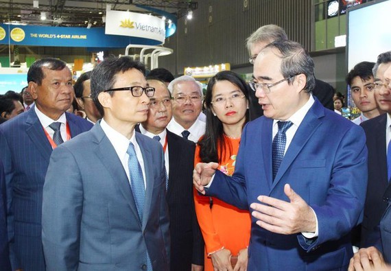 Deputy Prime Minister Vu Duc Dam (Left) and Party Chief Nguyen Thien Nhan ( Right) at the event (PHoto: SGGP)