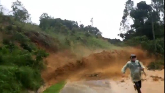 A person run out of the landslide-hit area.