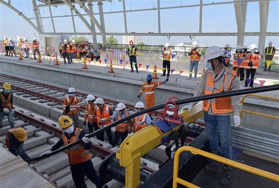 Cable pulling work on HCM City's Metro Line No 1 (Photo: VNA)