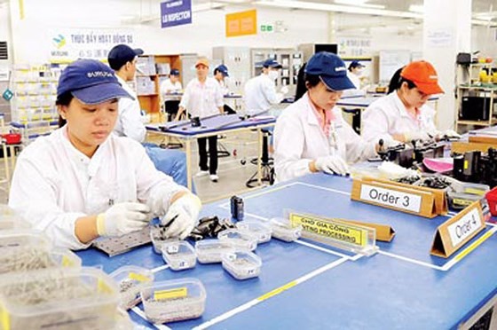 Workers at a Japanese firm in Linh Trung export processing zone, HCMC (Photo: SGGP)