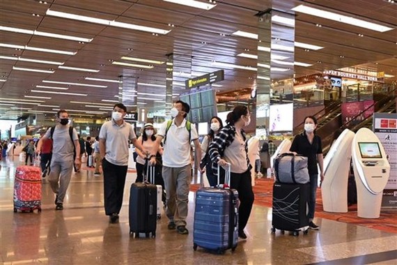 Passengers at Singapore's Changi airport (Photo: AFP/VNA)