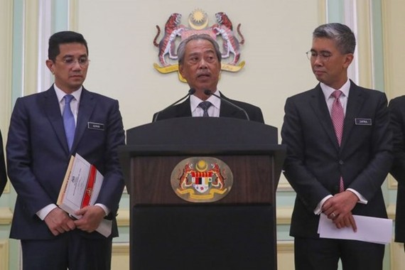 In a photo taken on March 16, 2020, Prime Minister Muhyiddin Yassin (centre) speaks during a press conference at the Prime Minister Office in Putrajaya, Malaysia. (Photo: straitstimes.com)