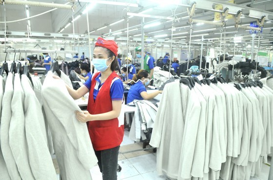 Making suits for export at Nha Be Garment Corporation