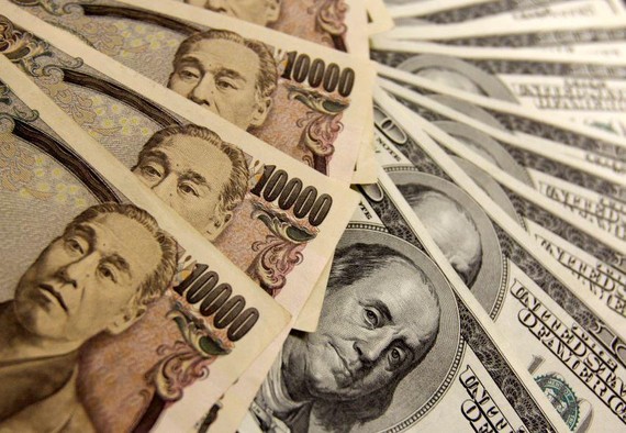 Japanese yen notes are piled atop U.S. dollar bills. Criminal groups may see Japan as an easy place to disguise illicit gains, a police source said.   © Reuters