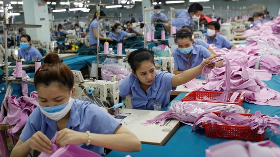 Workers piece together clothes at a factory in Ho Chi Minh City. Vietnam ranks as the world's third-largest apparel exporter.   © Reuters