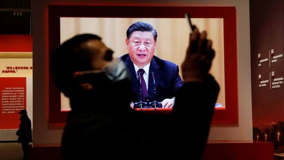A screen showing Xi Jinping at an installation in Wuhan designed to extol the Chinese government’s handling of the coronavirus pandemic. The exhibition does not mention any of the Communist party’s failings © REUTERS