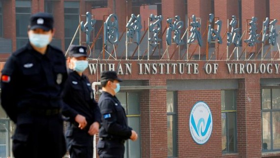Security personnel keep watch outside the Wuhan Institute of Virology during the visit by the World Health Organization team in February © Reuters