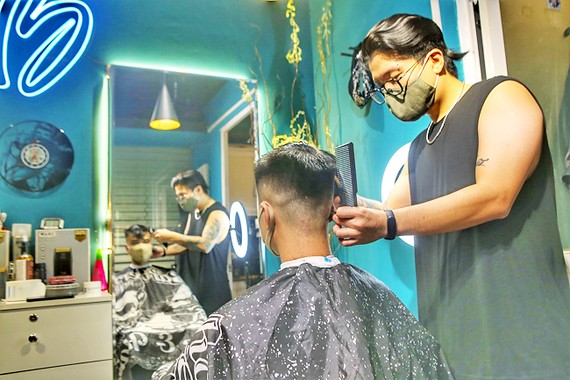 People are seen at a hair salon in Hanoi. PHOTO: XINHUA