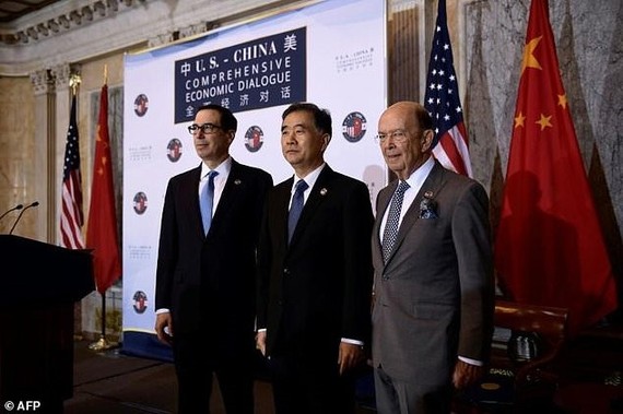 Treasury Secretary Steven Mnuchin, Chinese Vice Premier Wang Yang and Commerce Secretary Wilber Ross (left to right) open trade talks, with the US officials demanding more ’fair and reciprocal’ trade with China. — AFP/VNA