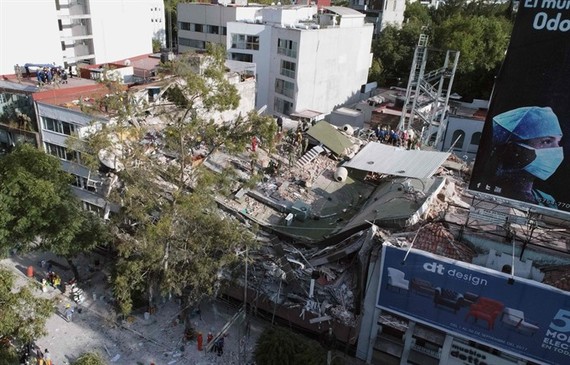 View of buildings flattened by a powerful quake in Mexico City on September 19. A devastating quake in Mexico on Tuesday killed more than 100 people, according to official tallies, with a preliminary 30 deaths recorded in the capital where rescue efforts 