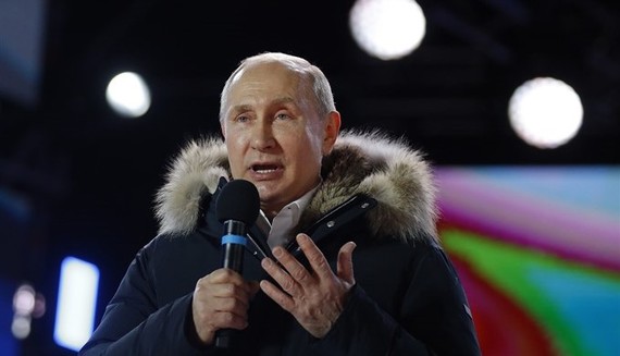 President Vladimir Putin addresses the crowd during a rally and a concert celebrating the fourth anniversary of Russia’s annexation of Crimea at Manezhnaya Square in Moscow on March 18, 2018. — AFP/VNA 