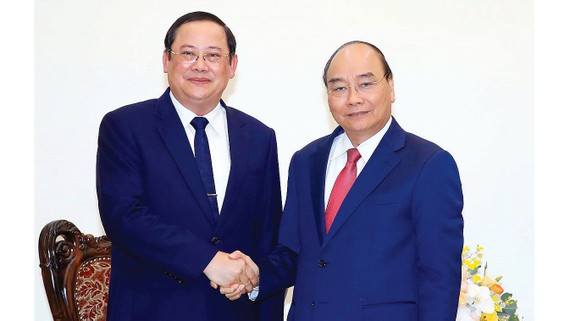 Thủ tướng Nguyễn Xuân Phúc tiếp Phó Thủ tướng kiêm Bộ trưởng Bộ KH-ĐT Lào Sonsay Siphandone. Ảnh: TTXVN