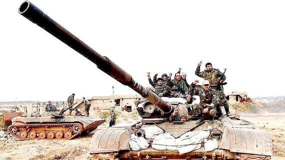 Quân đội Chính phủ Syria đẩy mạnh chiến dịch tấn công bất chấp đe dọa của Thổ Nhĩ Kỳ. Ảnh: AP