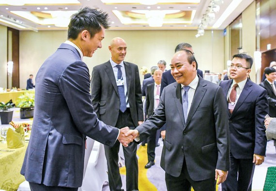 Thủ tướng Nguyễn Xuân Phúc chào mừng các doanh nghiệp tại VBS 2018. Ảnh: VIẾT CHUNG