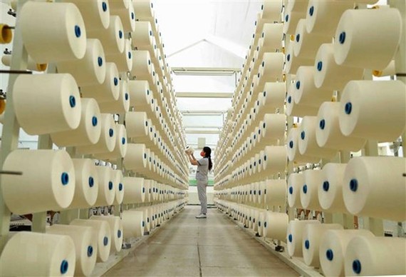 Dây chuyền sợi xuất khẩu tại Công ty TNHH dệt Phú Thọ. (Ảnh: TTXVN)