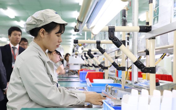 Nhiều doanh nghiệp kỳ vọng môi trường kinh doanh ở Hà Nội và TP.HCM sẽ thăng hạng để thúc đẩy sự phát triển mạnh hơn - Ảnh: Đ.TUÂN