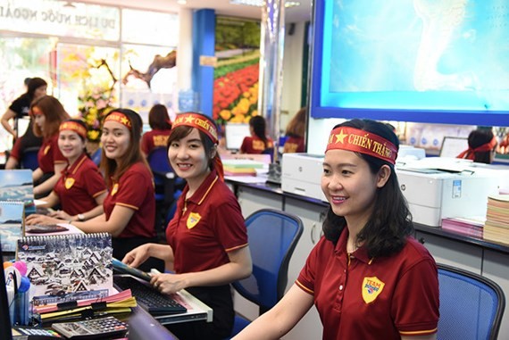 Many travel agents in VN have received a large number of tour bookings to China to support the Vietnam national U23 football team. (Photo: Sggp)
